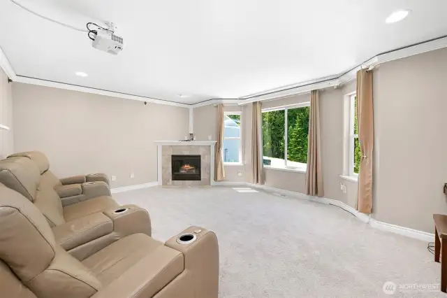 Second living space with fireplace and a projector