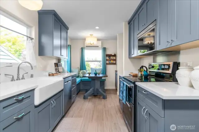 Beautiful shaker style cabinetry in cheerful custom color creating wonderful kitchen atmosphere