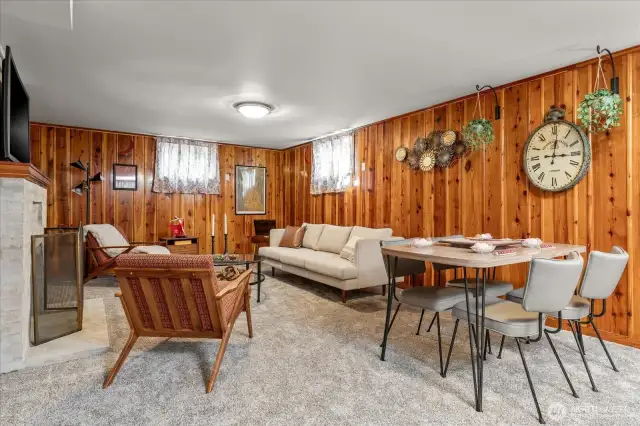 Preserving original character, the original warm pine wood walls in the lower level family room offers a feeling of comfort
