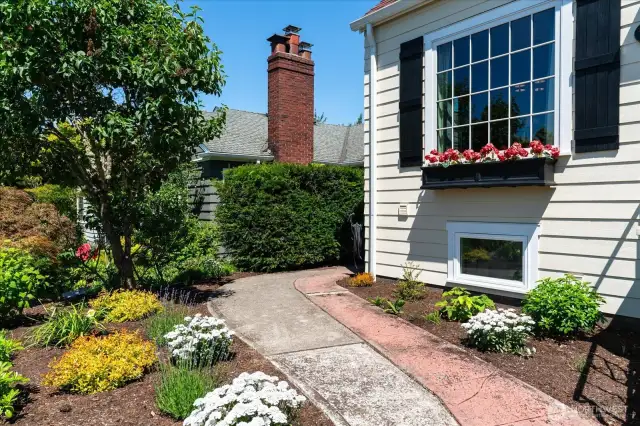 Oversized front windows, with shutters and flower boxes, add to the beautiful aesthetics of the home