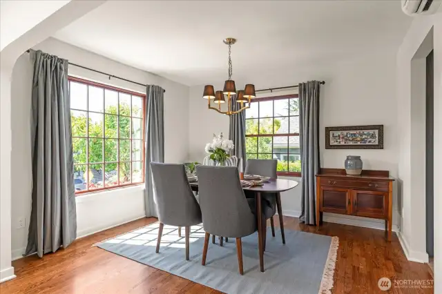 Wrap-around windows in lovely All Occasion dining room offers light and pleasant neighborhood views
