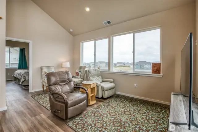 The primary suite sits behind the living room.