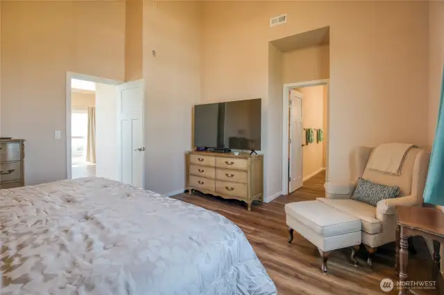 Primary bedroom leads into luxurious en-suite bath.