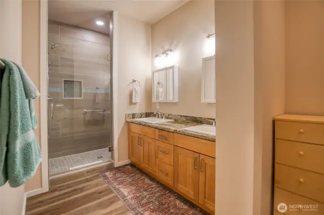 Dual vanity sinks and walk in shower.