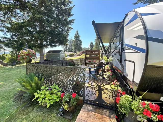 This deck and surrounding fence is included in the sale. This RV is not included but bring your RV and it is ready for you set up.