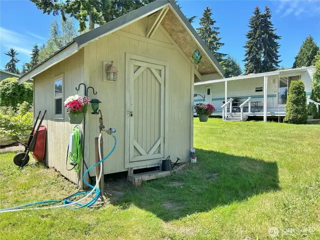 The shed has electricity. Make it a little workshop or storage for gardening tools.