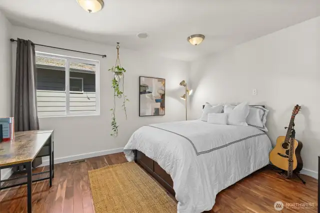 guest bedroom off stair case with walk-in closet