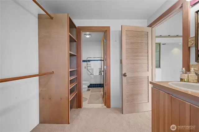 Primary bedroom walk in closet