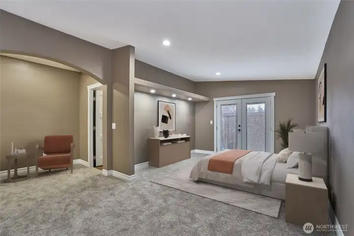 Primary bedroom with French doors.
