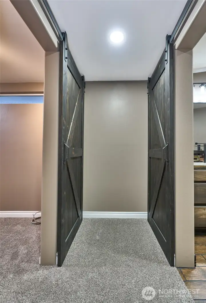 Primary suite - barn doors to walk-in closet and luxury primary bathroom.