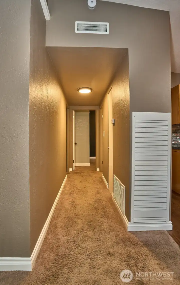 Hallway to bedrooms and custom full bath.