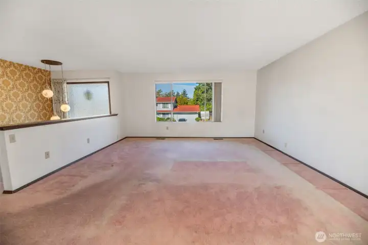 Large picture window and vaulted entry create lots of natural light.