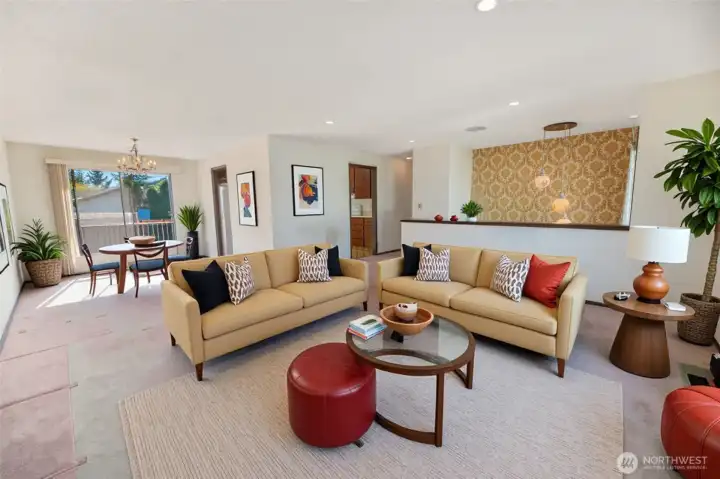 Virtually staged from the living room towards the dining room.