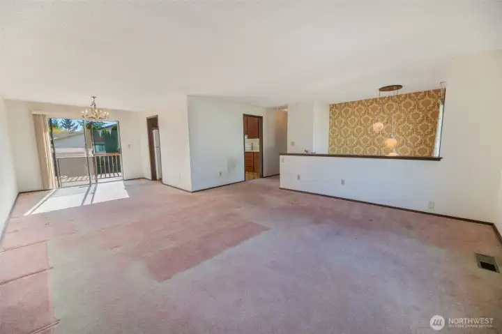 The wall to the kitchen can likely be opened up if you prefer a more open floor plan.