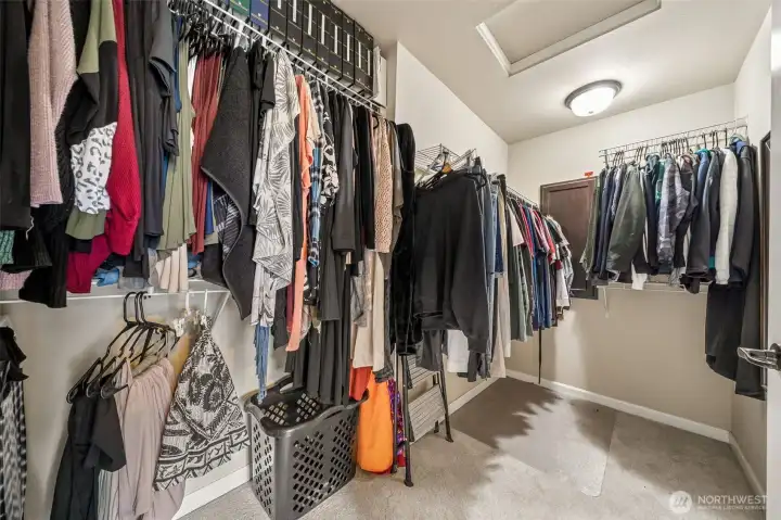 Master bedroom walk-in closet with plenty of storage.