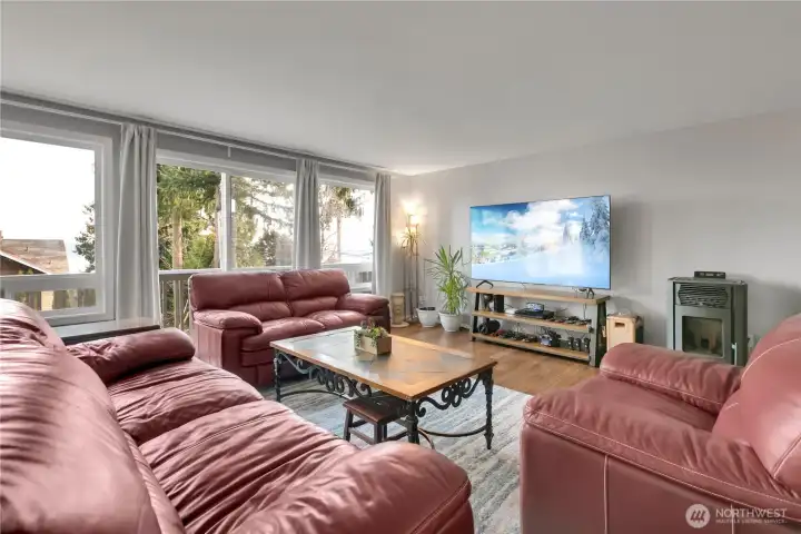Living room is spacious and overlooks Sound Views + amazing Sunrises!