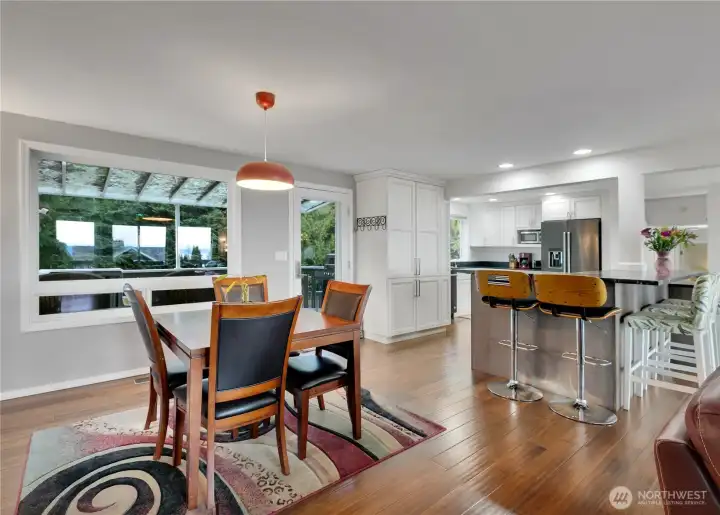 Kitchen nook seats 4+ and accesses back deck