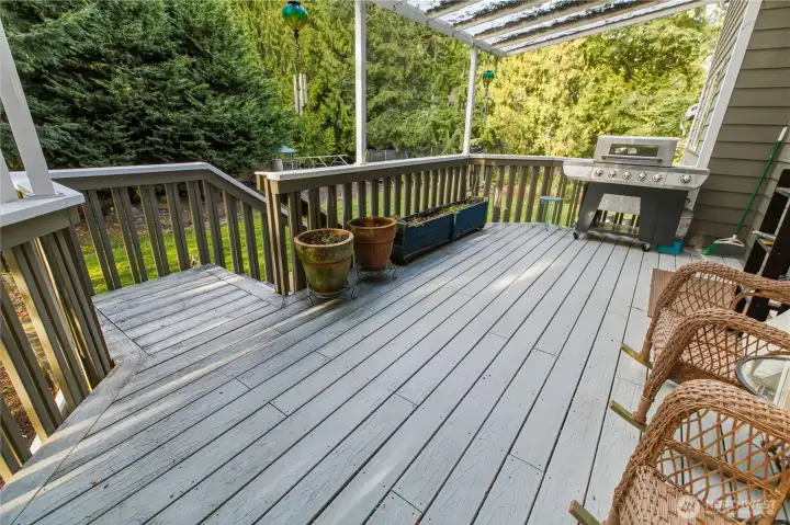 Covered deck off kitchen provides a cozy respite for morning coffee/tea