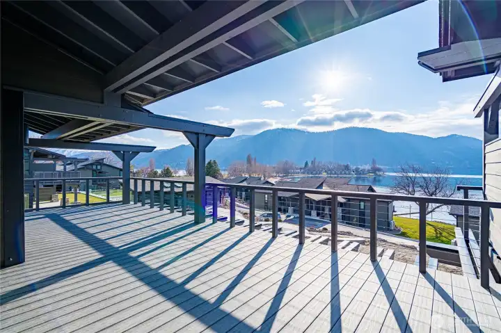 Indoor outdoor living with the double-sided fireplace and twin doors opening to the deck.  The living room offers relaxing space all year round.