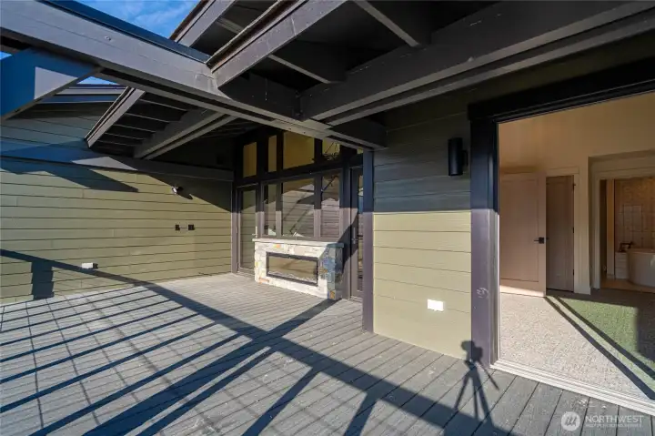 Spacious deck outside the living room lets you enjoy the outdoors any time of year with a double-sided fireplace. Pre-wired for ceiling patio heaters and pre-wired for your private hot tub addition.