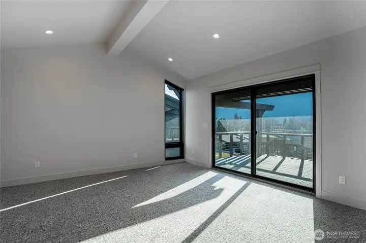 This light-filled second bedroom also features a glorious view of Lake Chelan with a private deck.