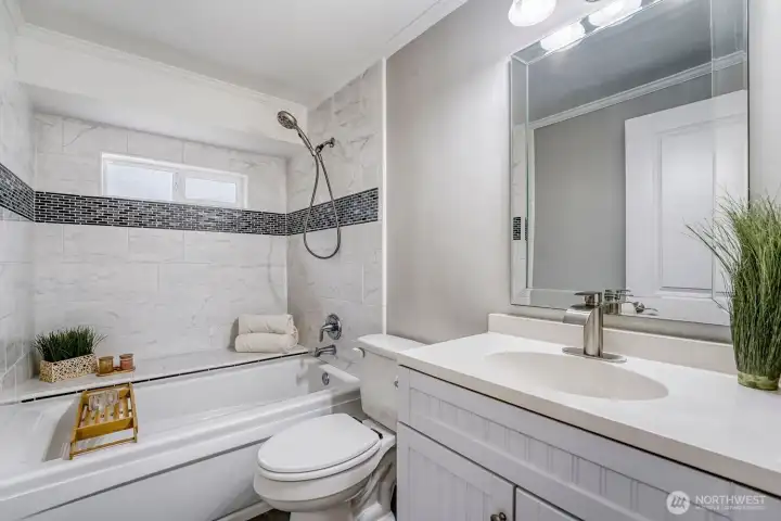 Unwind in your own private retreat featuring a luxurious jetted deep-soaking tub—perfect for relaxing at the end of the day.