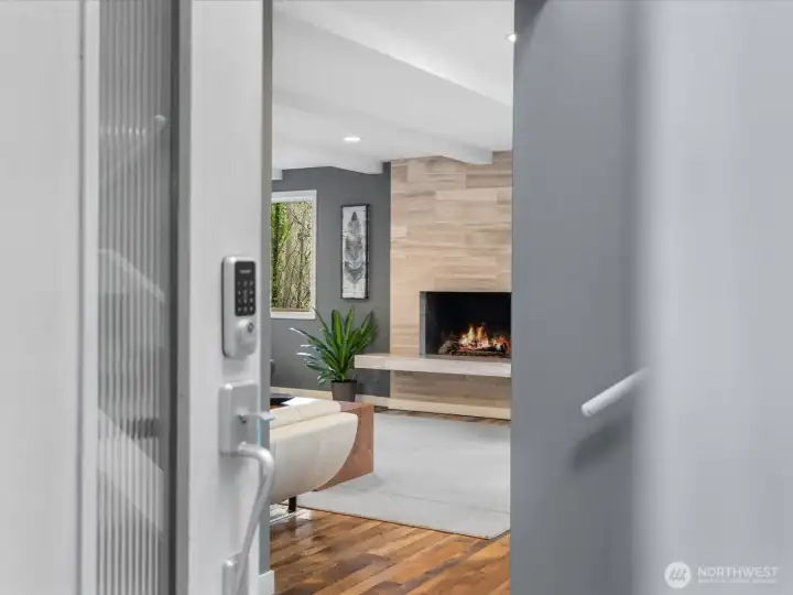 Walk into a world of refined modern luxury, where rich reclaimed oak hardwood floors lead you towards the living room.