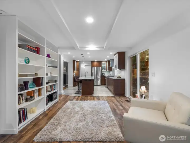 The heart of the home unfolds through the reading nook into this modern kitchen.