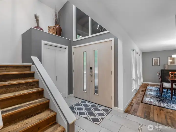 A striking staircase leads to the second level, where four well-appointed rooms await, (rare and well-sought feature)  enhanced by soaring ceilings and expansive windows that flood the space with natural light—creating an airy, uplifting ambiance that elevates everyday living.