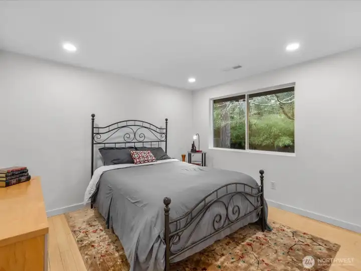 Bedroom #3 Serene retreat with bamboo flooring, forest views, modern recess lighting with brand new closet doors.