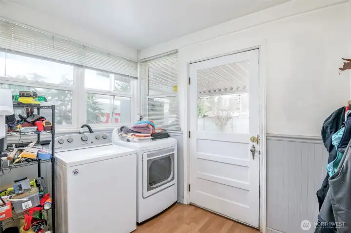 Laundry room leads to covered back porch.