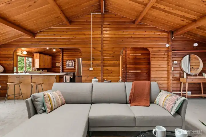 Stunning, vaulted wood ceiling with exposed beams offers a great room focal point