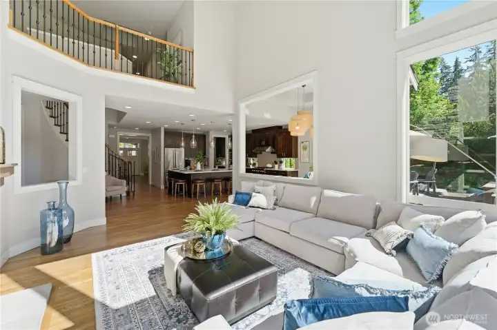 Open sightlines from the family room into the kitchen, front entry, and upstairs hallway make the space feel connected and easy to live in