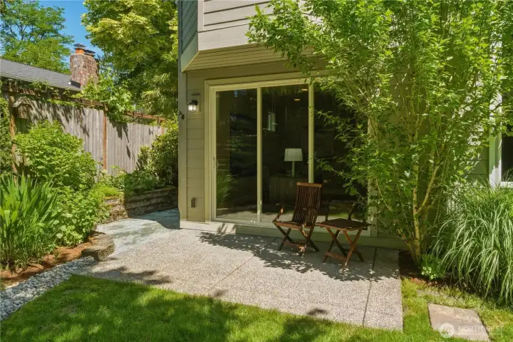 Just outside the office, this sweet patio enjoys soft afternoon light and the natural shade of a mature pink hibiscus - a peaceful spot to unwind or take a work break