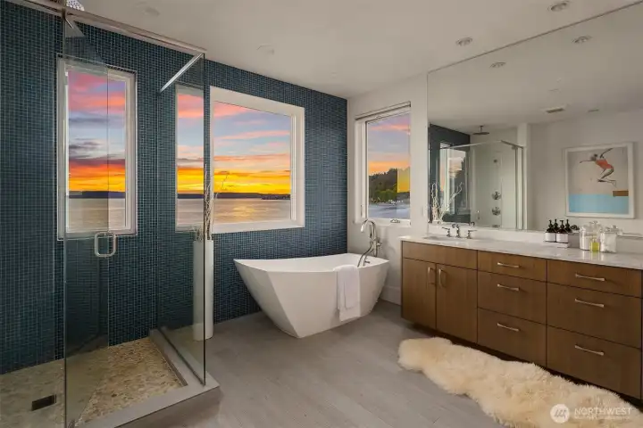 Primary has a spa-like custom bath with western water views. Primary has a spa-like custom bath with western water views.