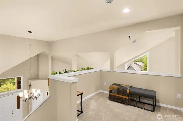 Second level landing overlooking living room and entry