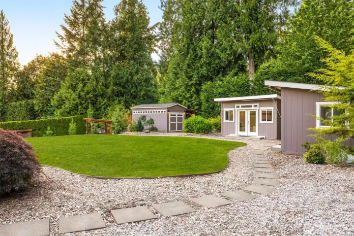 Welcome to the backyard oasis! Two detached offices plus finished shed, also with electricity.