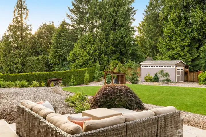 Spacious patio overlooking the backyard. Notice the mature lanscaping surrounding the property for privacy
