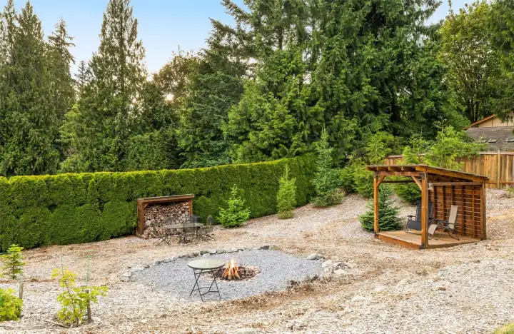 Travel away from the home to the fire pit, covered cabana