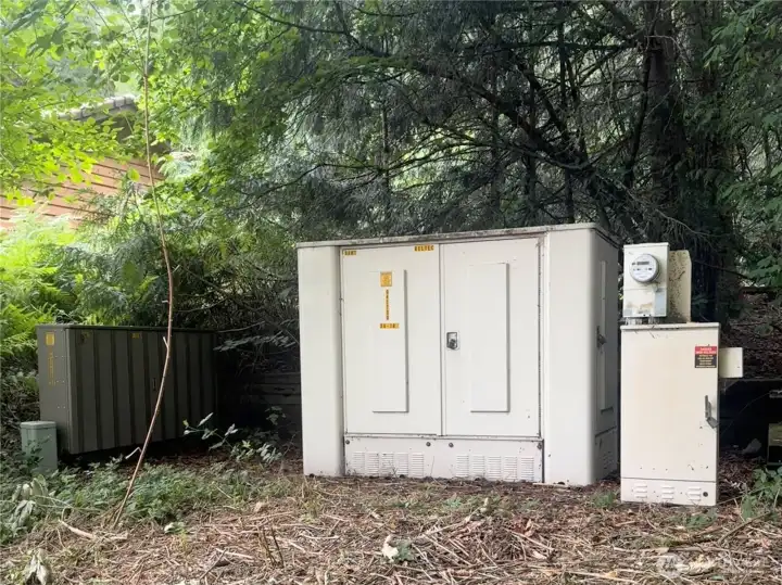 Power Station at the front of property to the left of entrance, off 11th.