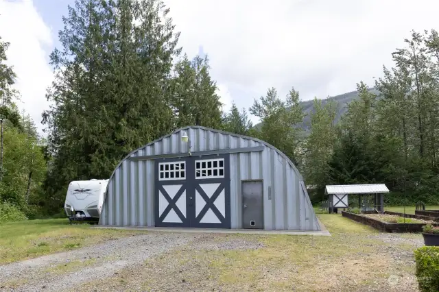 1600 sq.ft. detached steel garage/shop has 16' ceilings with plenty of room for your RV's, cars & toys..