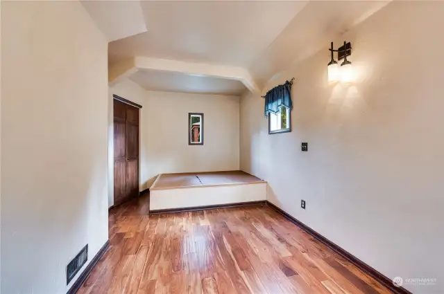 Main floor bedroom with en-suite.  The built-in platform bed allows a queen sized mattress and features hidden storage in its base