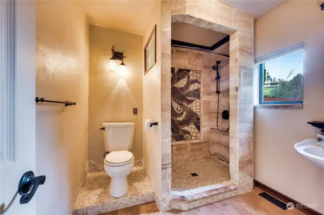 Main floor 3/4 bath with beautiful stonework!