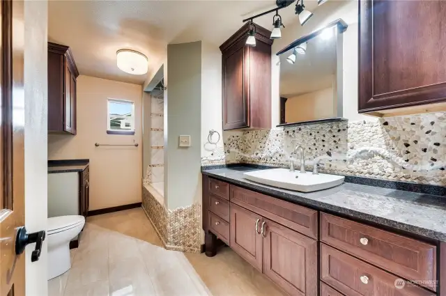 Second floor full bath with more beautiful stonework.