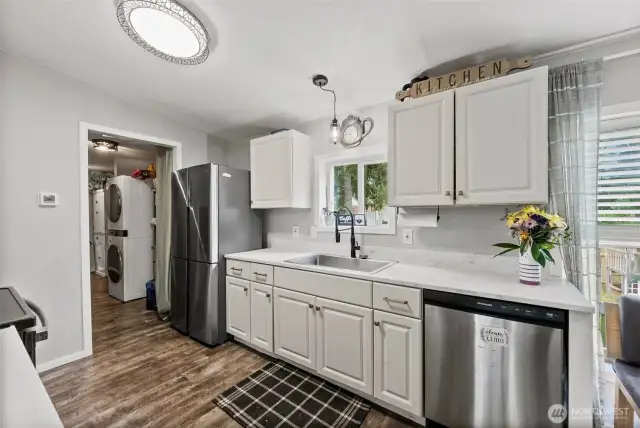 Kitchen with New Deep Sink Overlooks the Private Backyard!
