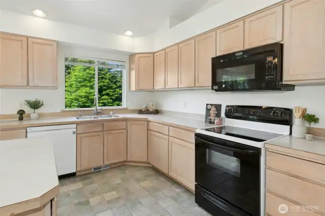 The kitchen sink window overlooks the fully fenced back yard.