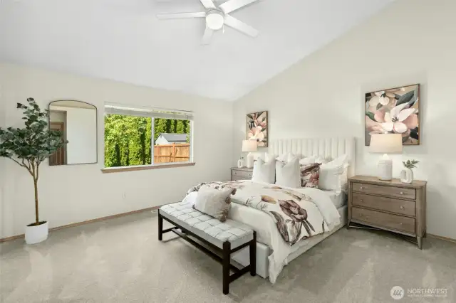 Beautiful primary bedroom with vaulted ceilings, again with fresh paint and new carpeting!