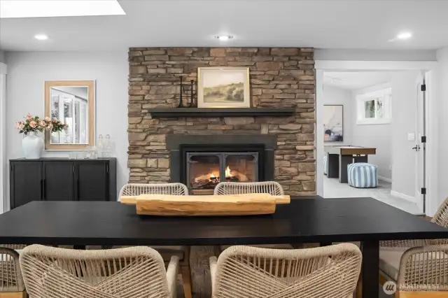 Stacked stone fireplace in the dining space is gorgeous! Two fireplaces in the living spaces provide ambiance and a warmth.