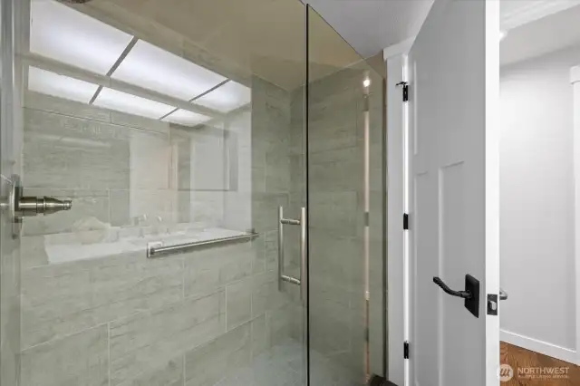 Glass-surround shower in the Guest bath is beautiful and modern.