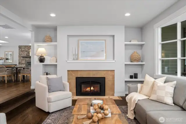 Living room with gas fireplace adds sophistication and ambiance! Built-ins to display your prized possessions.